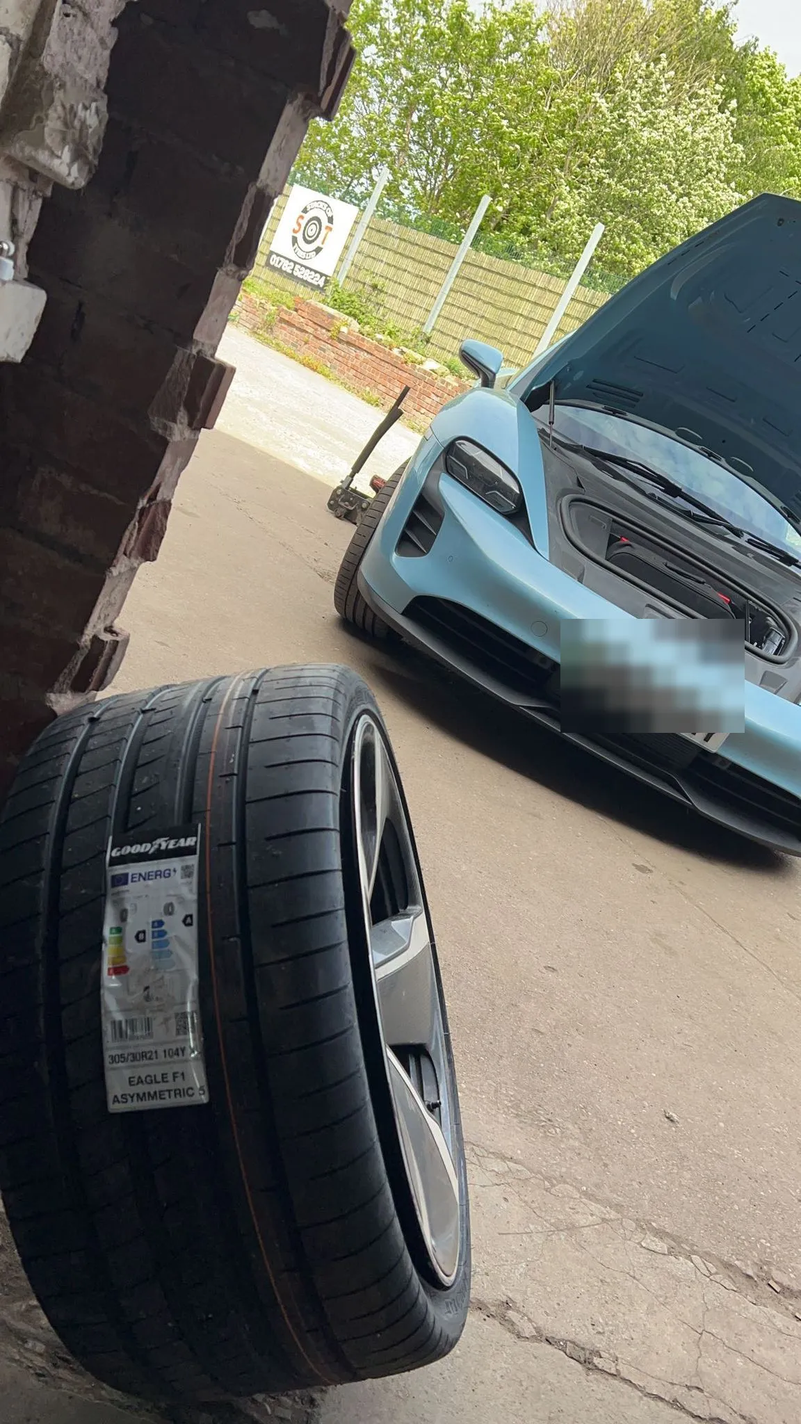 Porsche Taycan EV having a Goodyear Eagle F1 EV tyre fitted at Stacks of Tyres